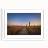 Abstract art print of Cape Hatteras with muted blue and beige tones on a framed white mat, ideal for dining room decor.