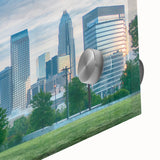 Large abstract wall art of Charlotte skyline in muted gray and blue tones on acrylic glass, ideal for dining room decor.