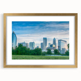 Extra large abstract art print of Charlotte skyline in muted earth tones on a framed canvas, ideal for living room decor.