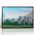 Large abstract wall art depicting the Charlotte skyline in muted gray and blue tones on a framed acrylic panel.