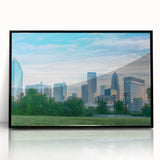 Large abstract wall art depicting the Charlotte skyline in muted gray and blue tones on a framed acrylic panel.