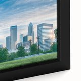 Extra large framed canvas of Charlotte, North Carolina skyline in black with colorful, textured highlights.