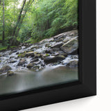 Textured black wall art depicting Durham, NC, with colorful abstract elements on a framed canvas.