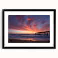 Abstract art print of Outer Banks scene with vibrant, textured colors on a large black-framed canvas.
