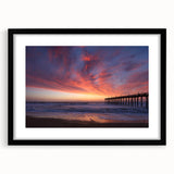 Abstract art print of Outer Banks scene with vibrant, textured colors on a large black-framed canvas.