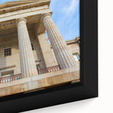 Textured black wall art of Raleigh skyline with colorful accents on a large framed canvas, ideal for living room decor.