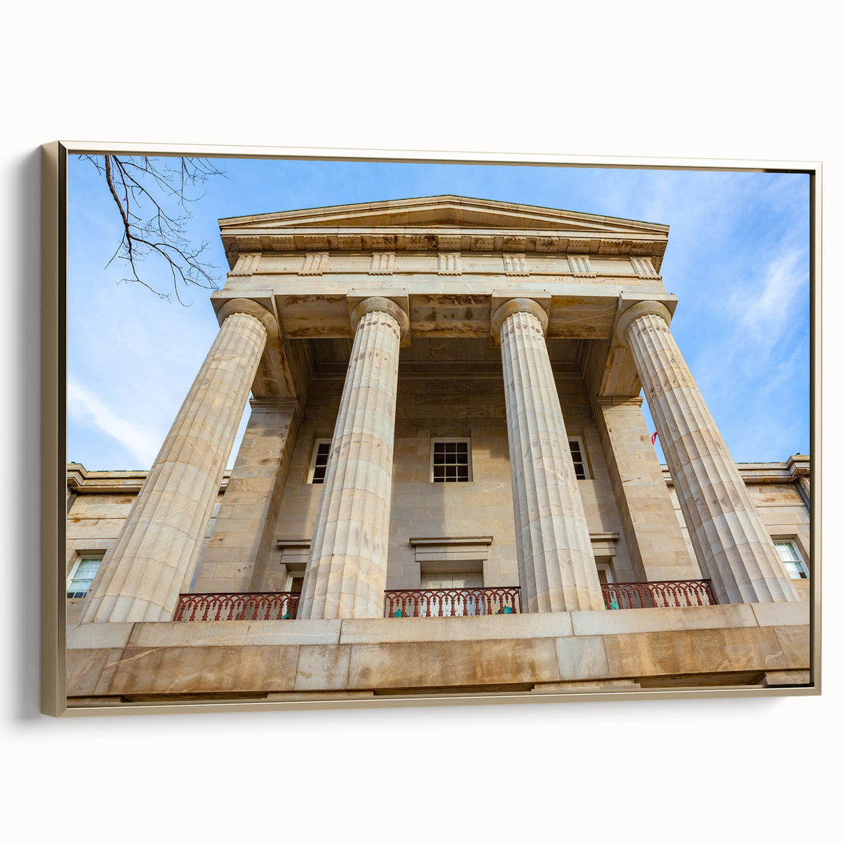 Framed canvas featuring a vintage-style landscape painting of Raleigh, North Carolina, in muted gold and black tones.
