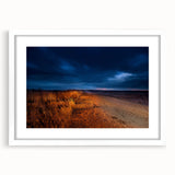 Abstract art print depicting a North Dakota landscape in muted earth tones on a framed white mat.