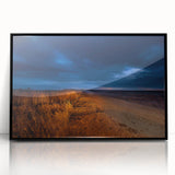 Large abstract wall art depicting North Dakota scenery in muted earth tones, framed in black acrylic.