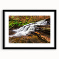 Colorful abstract art print of Adirondack scenery in textured style, framed in black.