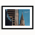 Abstract art print of the Chrysler Building in vibrant colors, textured on a large framed canvas.