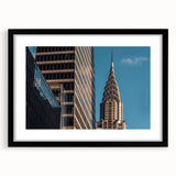 Abstract art print of the Chrysler Building in vibrant colors, textured on a large framed canvas.