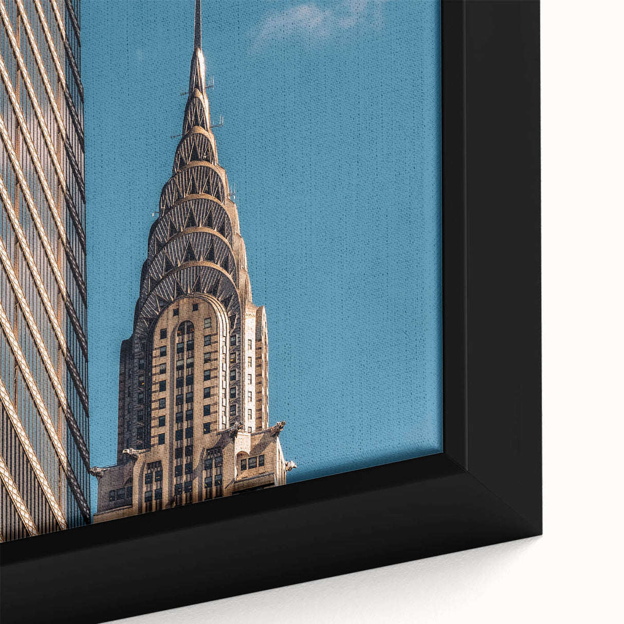 Close-up of a textured black wall art featuring the Chrysler Building in colorful, extra large framed canvas format.
