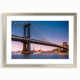 Textured art print of the Manhattan Bridge in muted gray and blue tones on a framed canvas, suitable for bedroom decor.