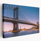 Side view of a large stretched canvas featuring the Manhattan Bridge in muted gray and blue tones.
