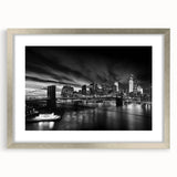 Textured art print of abstract Manhattan skyline in muted silver and gray tones, framed with a silver mat.