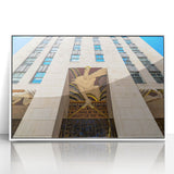 Acrylic print of New York City skyline in muted gray and blue tones, framed in white, ideal for modern bedroom ambiance.