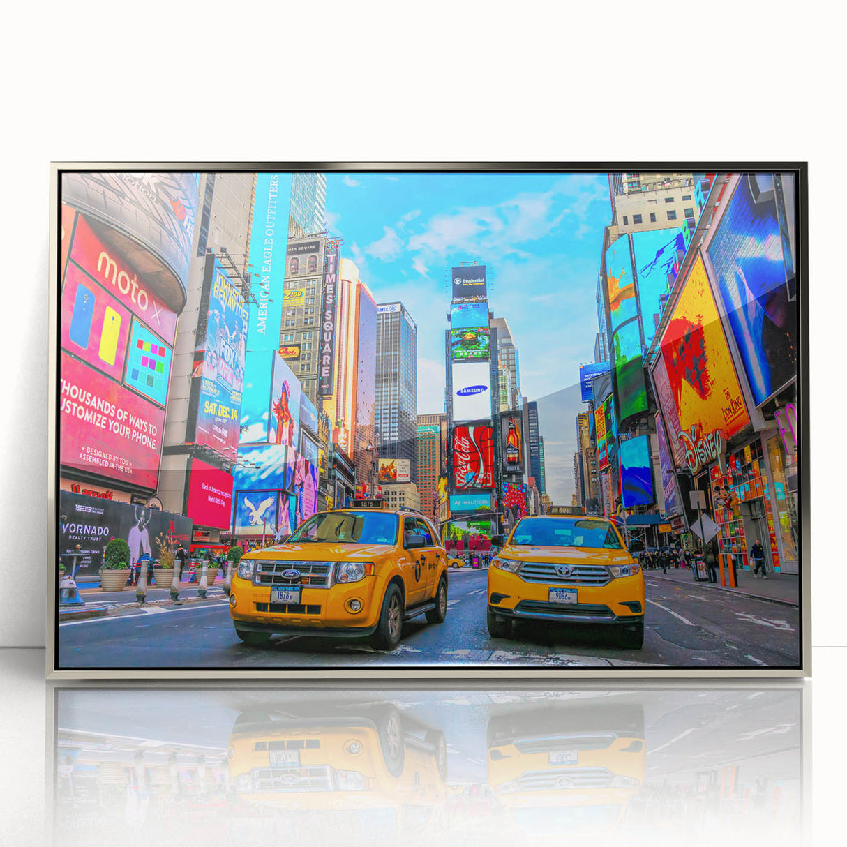 Mid-century modernist art depicting Times Square with vibrant colors on a silver-framed acrylic print.