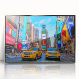 Mid-century modernist art depicting Times Square with vibrant colors on a silver-framed acrylic print.