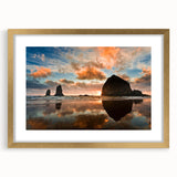 Extra large abstract art print of Cannon Beach, Oregon, in muted gray tones on a textured canvas, framed in gold.