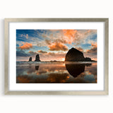 Textured art print of Cannon Beach, Oregon, with abstract elements in muted earth tones on a framed silver mat.