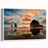 Framed vintage poster art of Cannon Beach, Oregon, featuring a colorful palette on white canvas, ideal for living room decor.