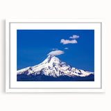 Abstract art print of Mount Hood in muted blue and gray tones on a white framed canvas.