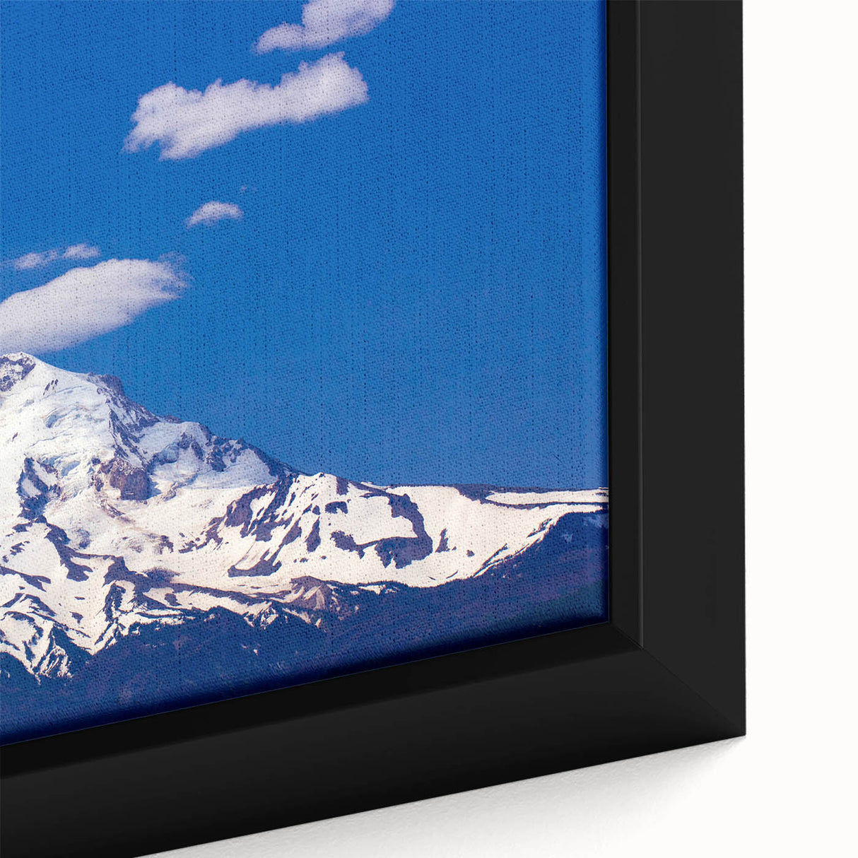 Close-up of a framed canvas featuring Mount Hood in Oregon with textured, colorful art on a black background.