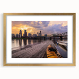 Extra large abstract art print of Portland scenery in muted green and blue tones on a gold-framed canvas.