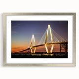 Textured abstract art print of Charleston scenery in muted earth tones on a framed silver mat, suitable for bedroom decor.