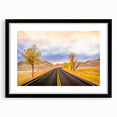 Colorful abstract art print of South Dakota Badlands in vibrant hues on a large textured canvas, framed in black.