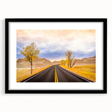 Colorful abstract art print of South Dakota Badlands in vibrant hues on a large textured canvas, framed in black.