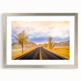 Textured abstract art print of South Dakota Badlands in muted earth tones on a framed silver mat, suitable for bedroom art.