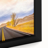 Textured black wall art depicting the South Dakota Badlands in colorful hues on an extra large framed canvas.