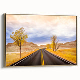 Framed canvas wall art featuring a landscape painting of South Dakota Badlands in muted earth tones, ideal for bedroom decor.