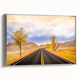 Framed canvas landscape art painting featuring the South Dakota Badlands in a vintage poster style with a black and colorful…