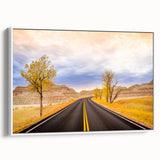 Vintage poster art of South Dakota Badlands on framed canvas, featuring earthy tones, ideal for living room decor.