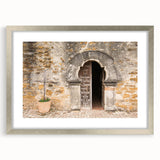 Textured abstract art print of San Antonio skyline in muted earth tones, framed with a silver mat, ideal for bedroom decor.