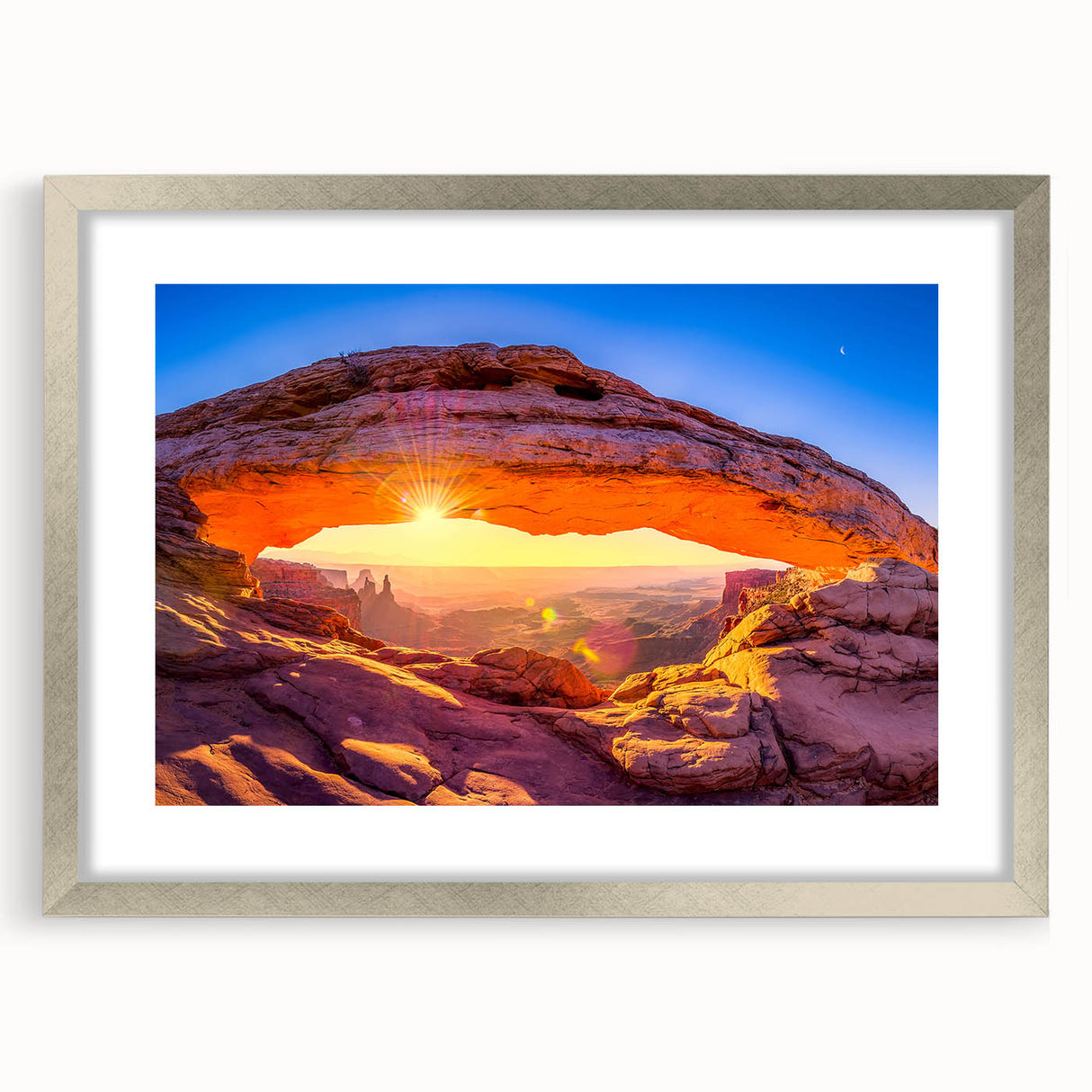 Textured art print of Arches National Park in muted earth tones on a silver-framed canvas, ideal for bedroom art.