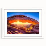 Abstract art print of Arches National Park in muted orange and blue tones on a framed white mat, ideal for dining room decor.