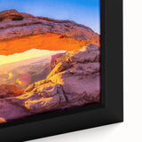 Close-up of a framed canvas featuring a textured depiction of Utah Arches in black with vibrant, colorful accents.