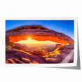 Arches National Park landscape on rolled print, featuring red rock formations under a clear blue sky.