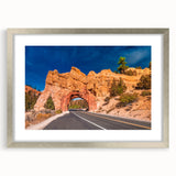 Textured art depicting abstract Bryce Canyon in earthy red and orange tones, framed with a silver mat.