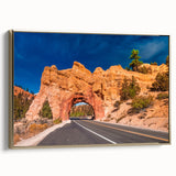 Framed canvas depicting a vintage-style landscape of Bryce Canyon in muted gold and black tones, ideal for bedroom wall art.