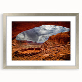 Textured art print of Canyonlands with abstract red and orange hues on a framed silver mat, suitable for bedroom decor.