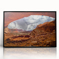 Large abstract wall art depicting Canyonlands with vibrant orange and red tones, framed in black acrylic.