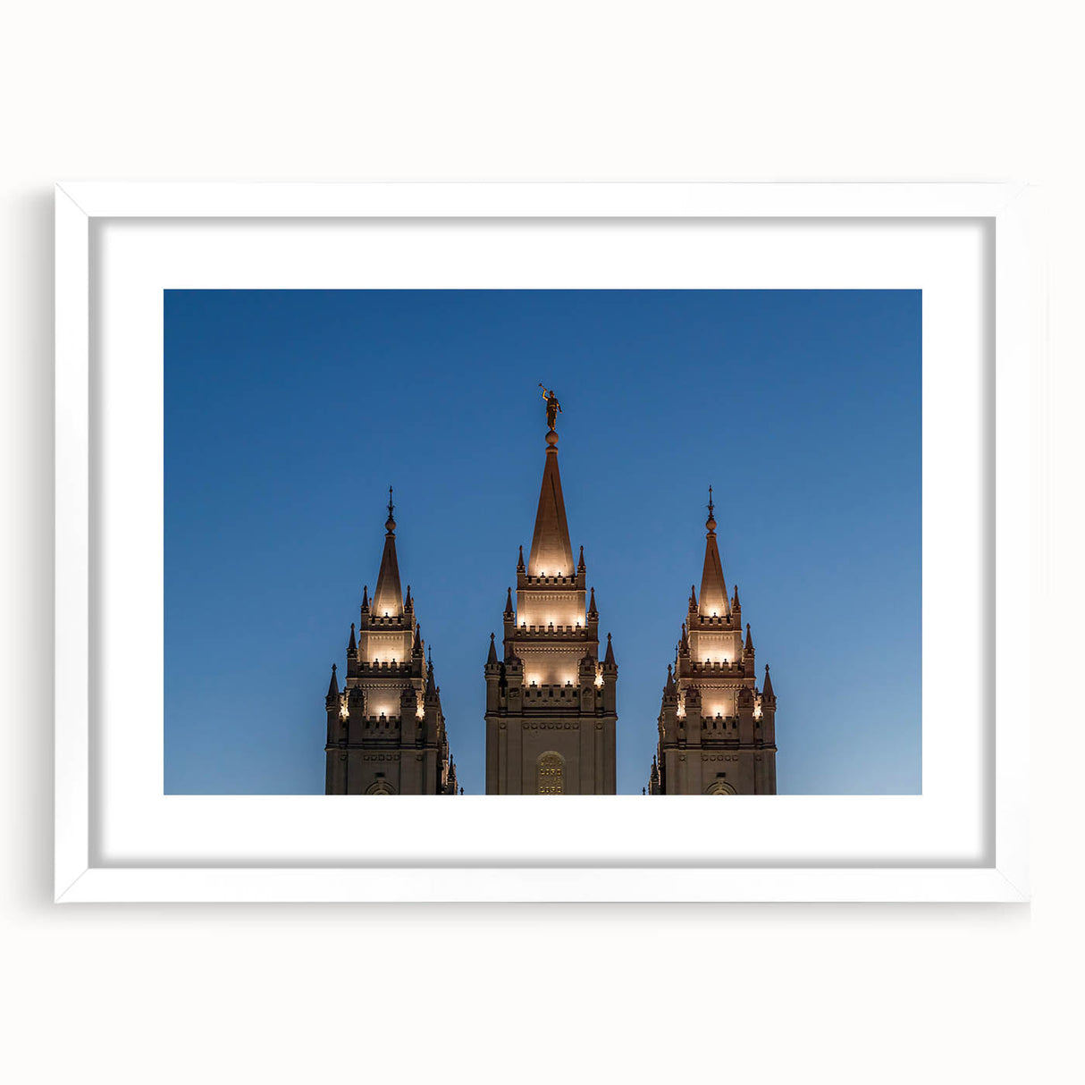 Abstract art print of Salt Lake City with vibrant blue and orange tones on a white framed mat.