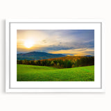 Abstract art print of Vermont scenery in muted green and blue tones, framed with a white mat, suitable for dining room decor.