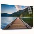 Acrylic print of Olympic National Park with lush greenery and mountain backdrop, in subdued earth tones.