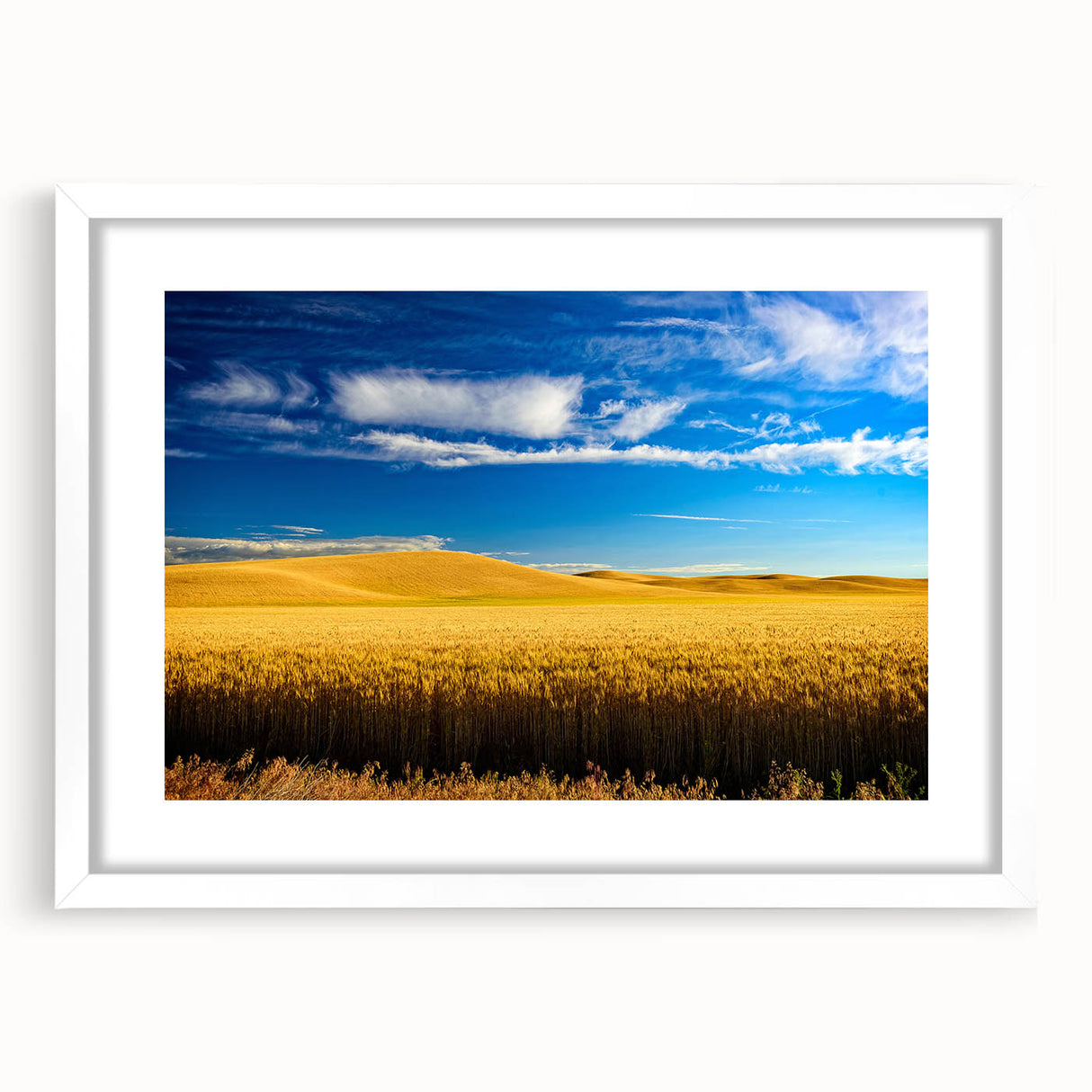 Abstract art print of Palouse, Washington in muted earth tones on a white framed mat, suitable for dining room decor.